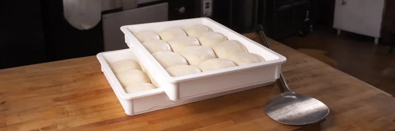Rolling Dough dough balls proofing in boxes